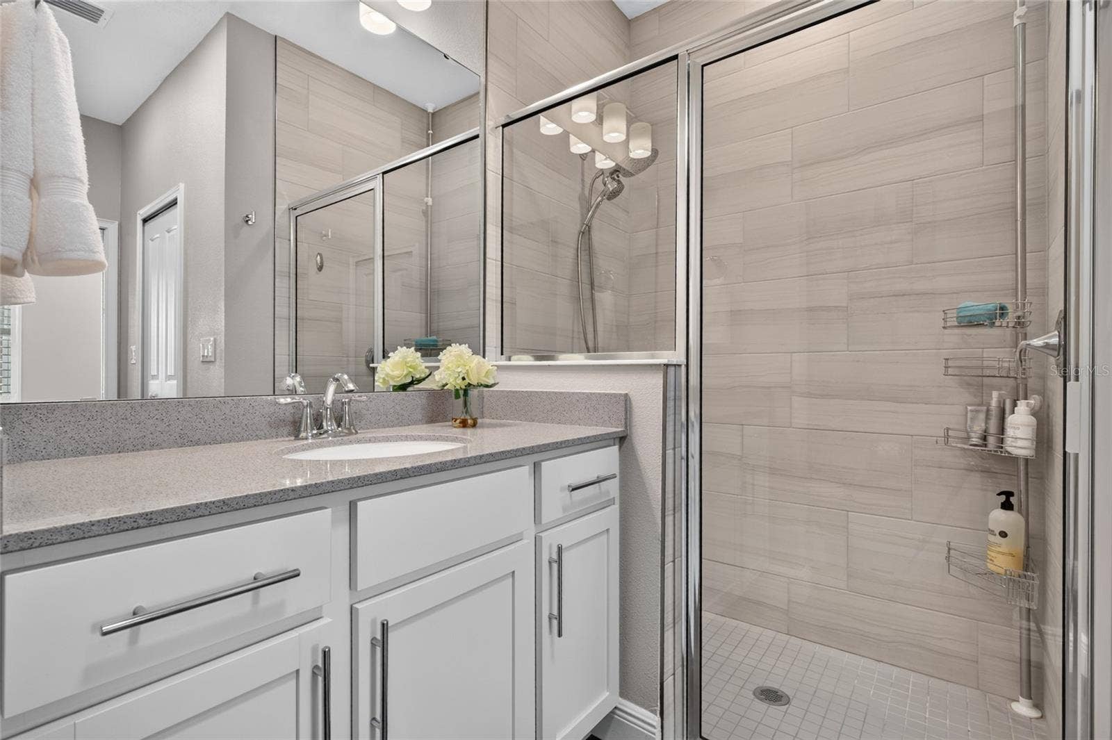 4408 BEDFORD WAY, Leesburg, FL 34748 walk in shower with floor to ceiling ceramice tile