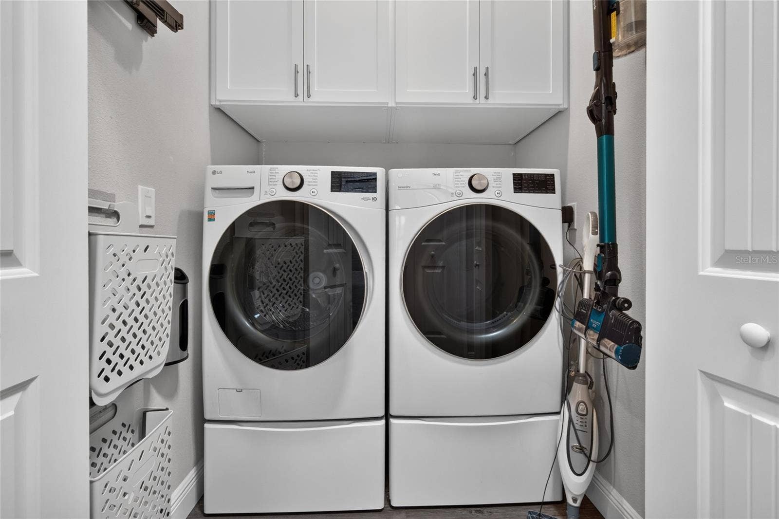 4408 BEDFORD WAY, Leesburg, FL 34748 Laundry room with custom built in storage