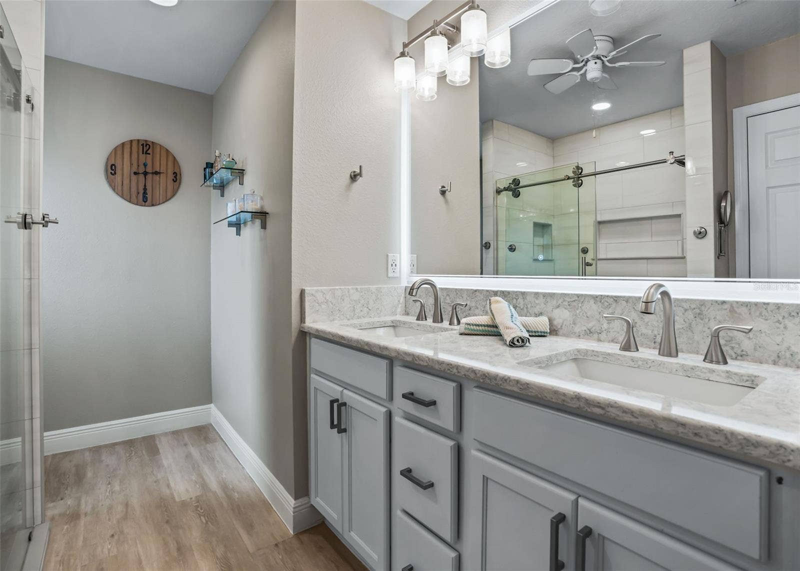 3229 DRESSENDORFER DRIVE, The Villages, FL 32163 Primary bath with dual vanity. Quartz Countertops