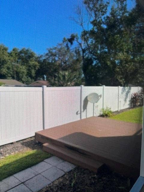 2368 CONESTOGA DRIVE, Leesburg, FL 34748 Open deck at back of property and Vinyl fencing