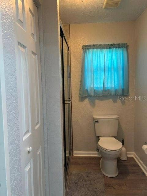 2368 CONESTOGA DRIVE, Leesburg, FL 34748 Water Closet area with Glass in Shower and Linen Closet on Left