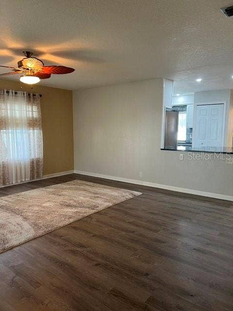 2368 CONESTOGA DRIVE, Leesburg, FL 34748 Living Room area and view into kitchen.