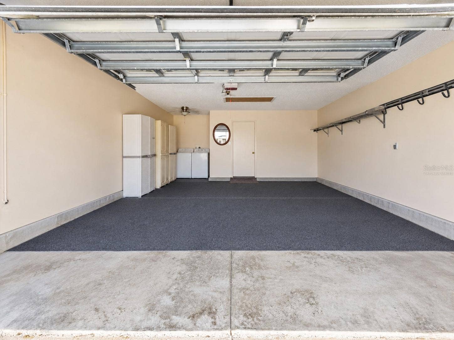 2022 CRISTO ROAD, The Villages, FL 32159 Garage Virtually Staged as an empty space