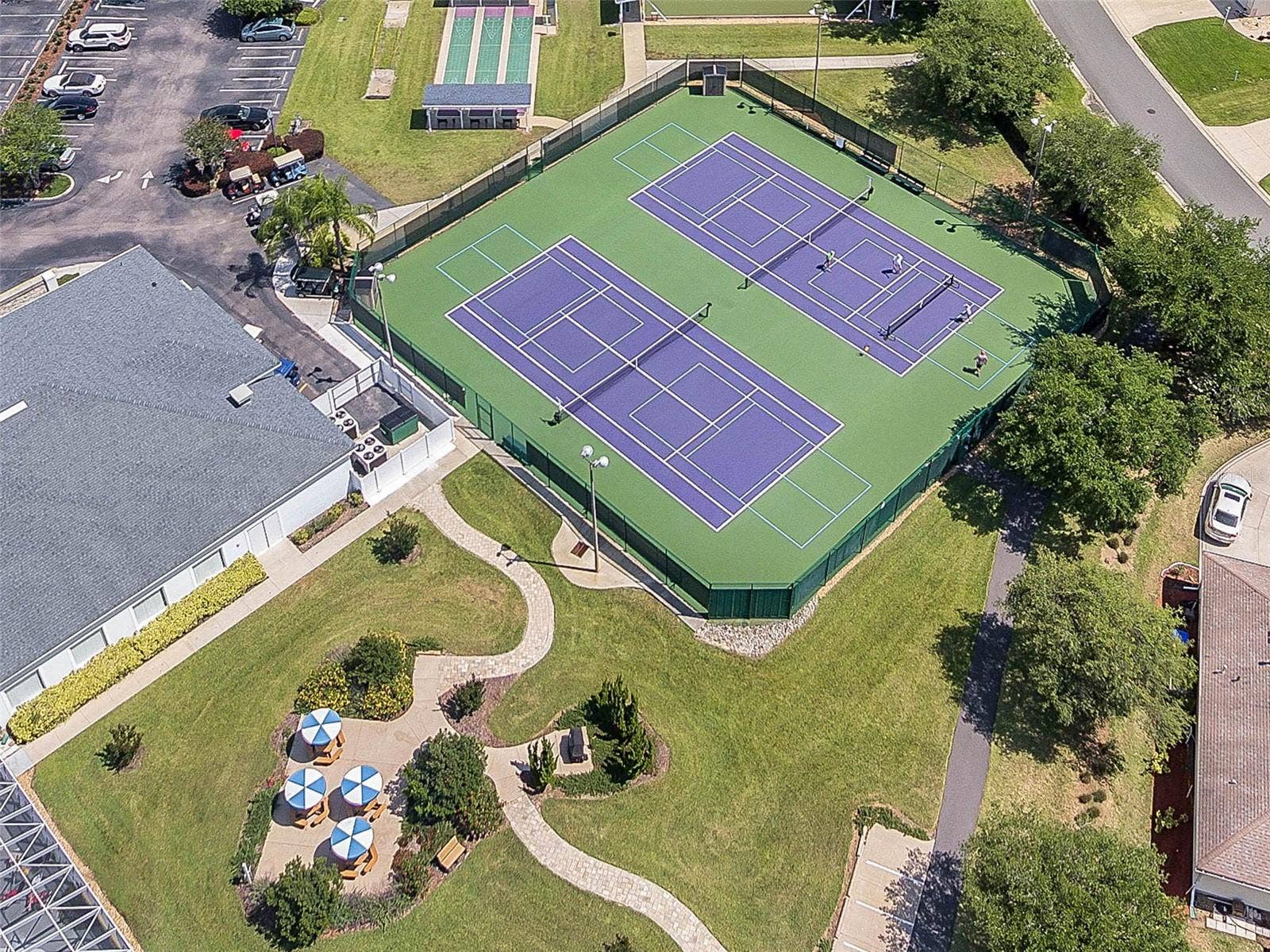 4900 CANOE COURT, Tavares, FL 32778 Courts and shaded seating near the clubhouse.