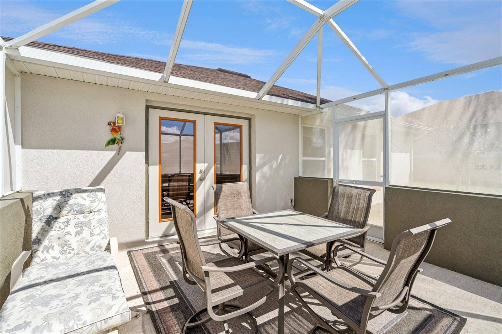 4900 CANOE COURT, Tavares, FL 32778 Screened Lanai - 13.5 X 13.4 - right through the Living Room French Doors.