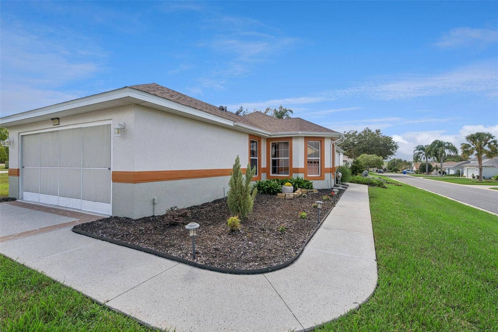 4900 CANOE COURT, Tavares, FL 32778 Custom coated walkway to the front door.