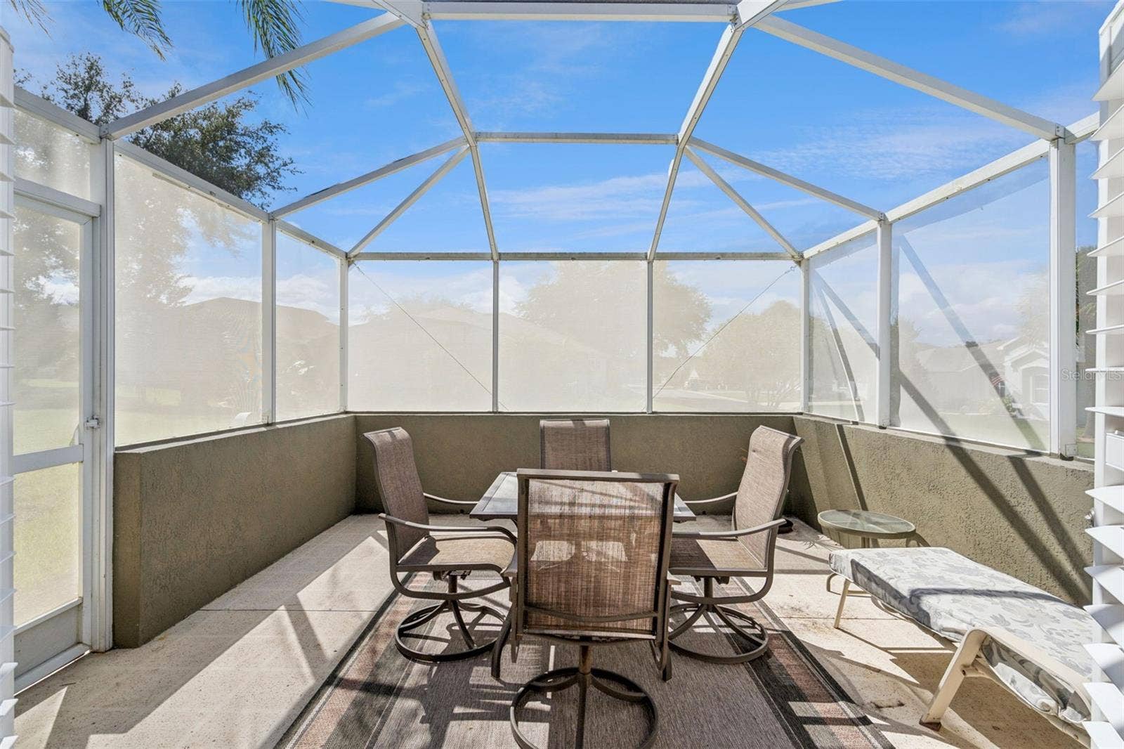 4900 CANOE COURT, Tavares, FL 32778 Larger screened lanai - 13.5 X 13.4 - with room to dine and relax.