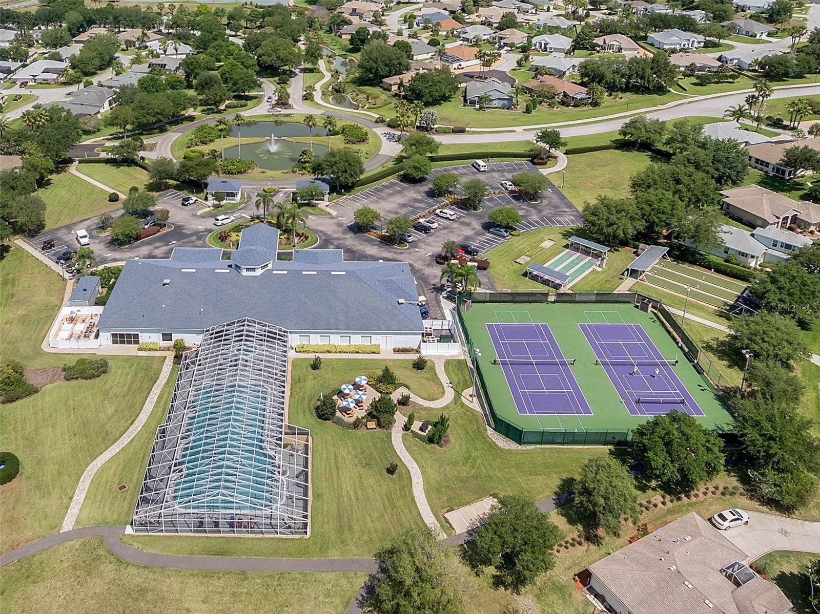 4900 CANOE COURT, Tavares, FL 32778 Clubhouse, pool, courts and walking paths.
