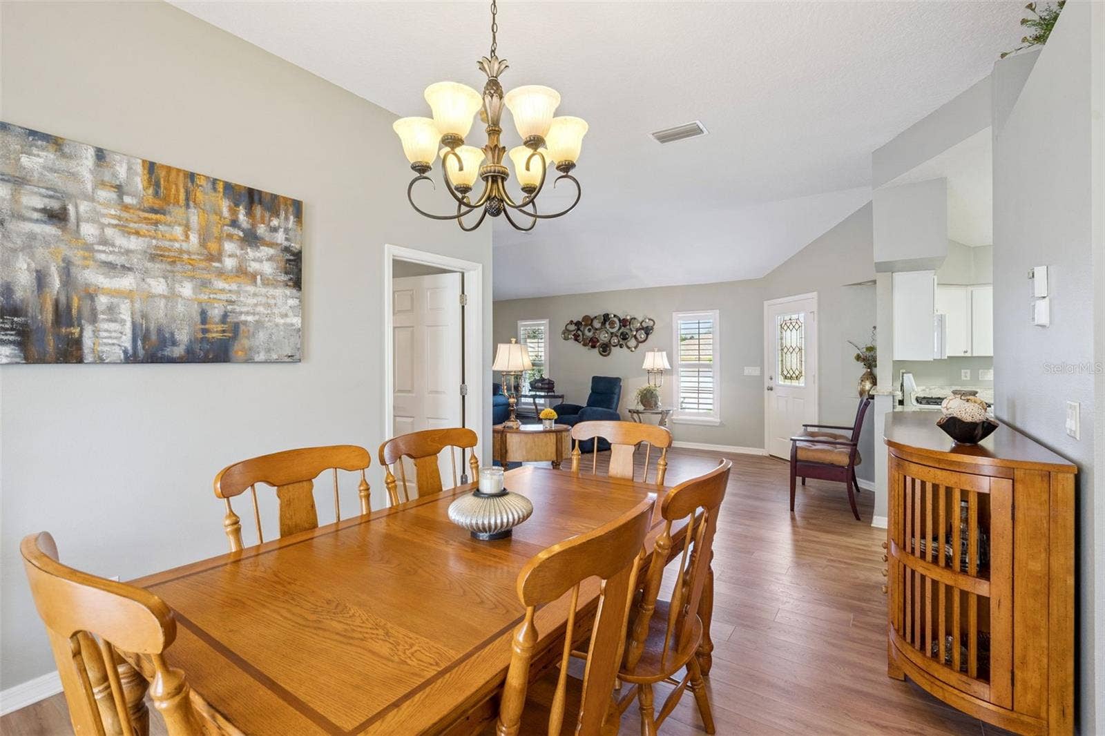 4900 CANOE COURT, Tavares, FL 32778 Dining Room French doors open to the second screened lanai.