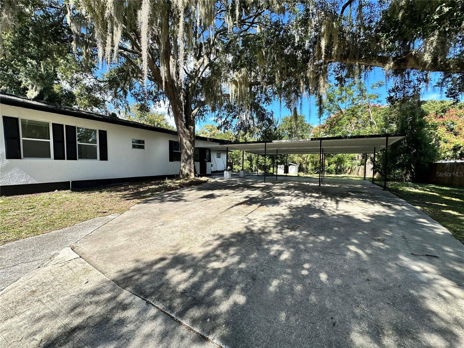 1208 BONAIRE DRIVE, Leesburg, FL 34748 Side with Carport