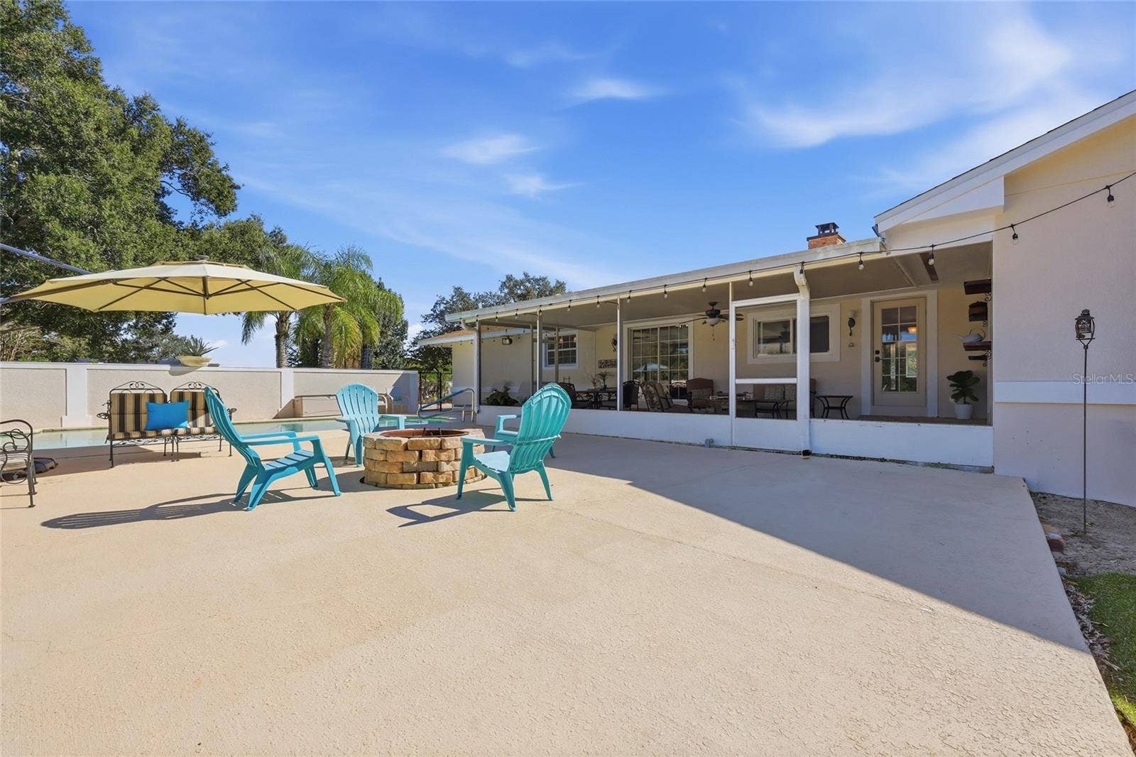 13205 MARIA AVENUE, Clermont, FL 34711 Large deck area with firepit & plenty of seatind area