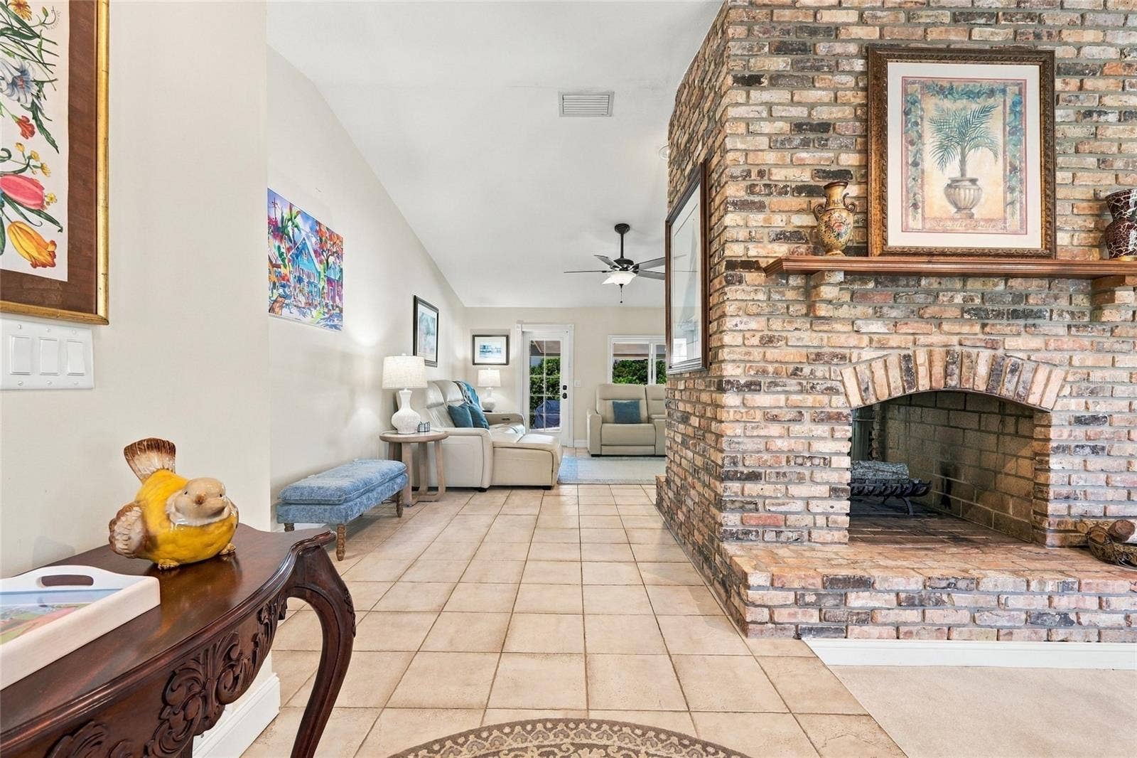 13205 MARIA AVENUE, Clermont, FL 34711 Front entrance with view of see through fireplace
