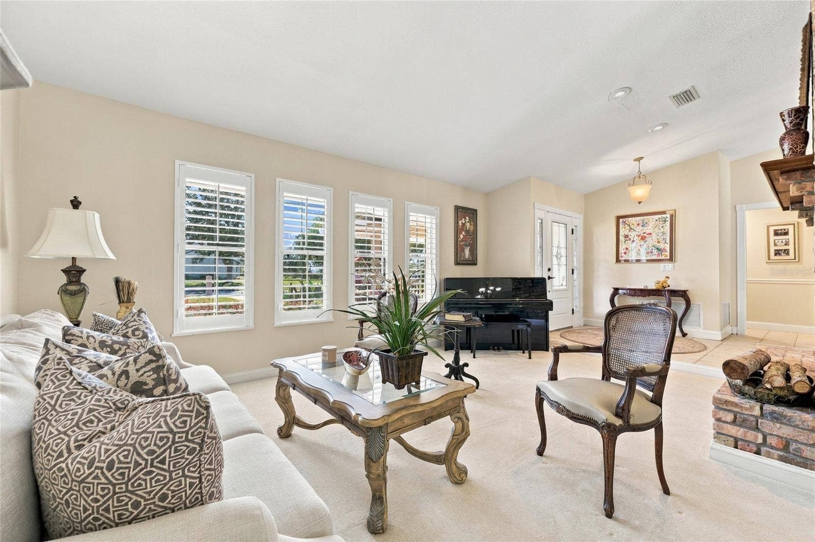 13205 MARIA AVENUE, Clermont, FL 34711 Living Room with plantation shutters