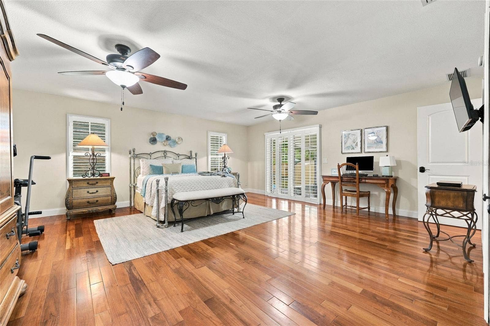 13205 MARIA AVENUE, Clermont, FL 34711 Primary bedroom with doors out to lanai