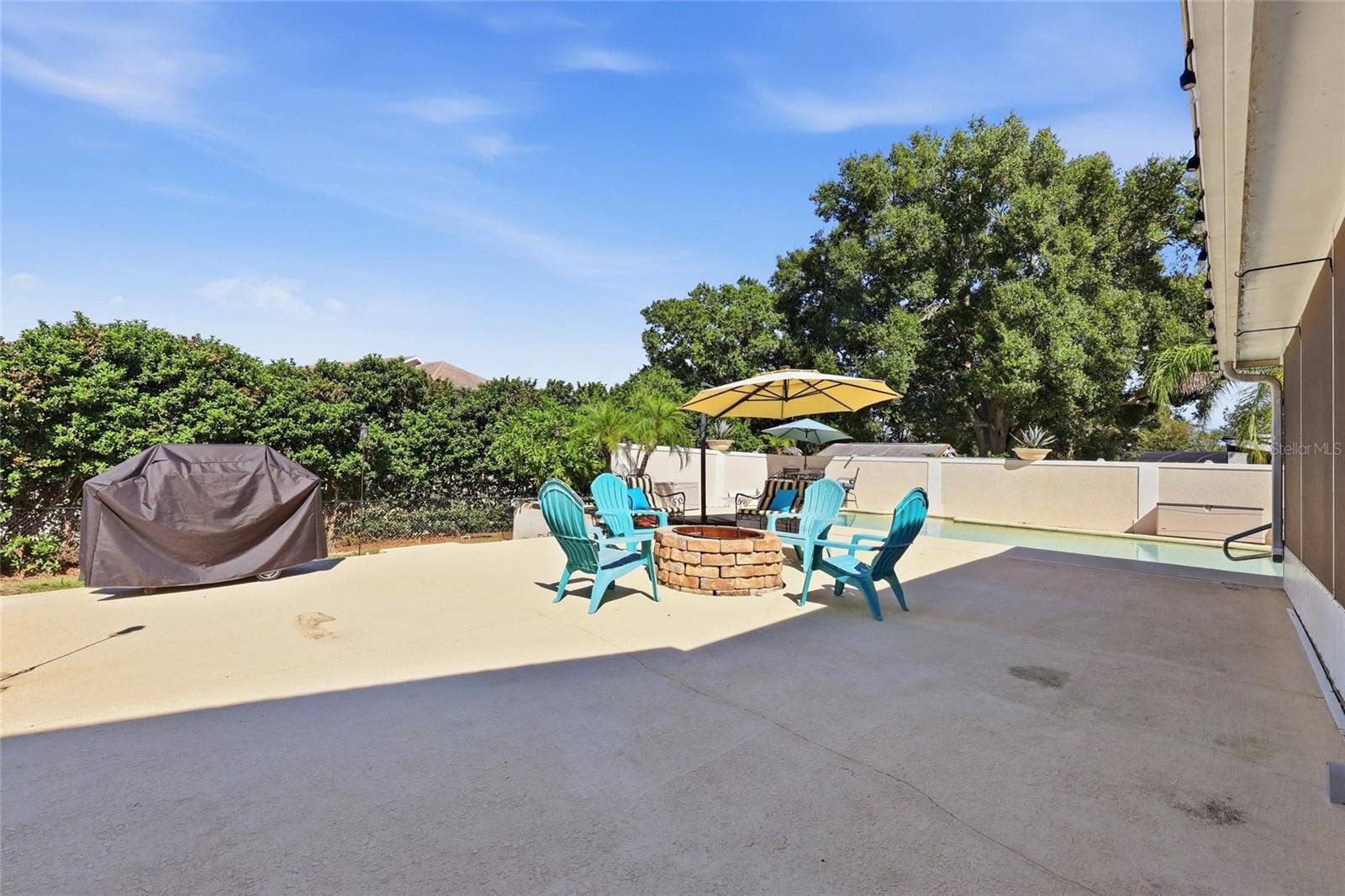 13205 MARIA AVENUE, Clermont, FL 34711 Large deck area with firepit & plenty of seatind area