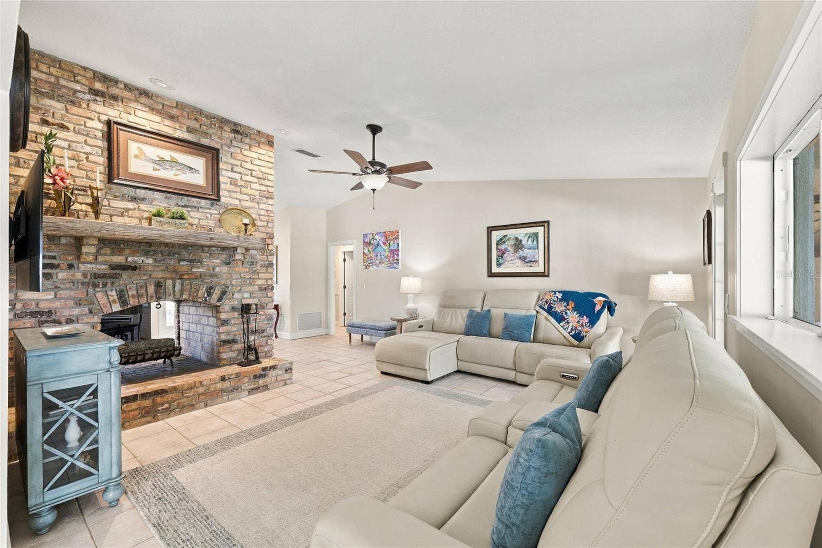 13205 MARIA AVENUE, Clermont, FL 34711 Family room with wood burning fireplace
