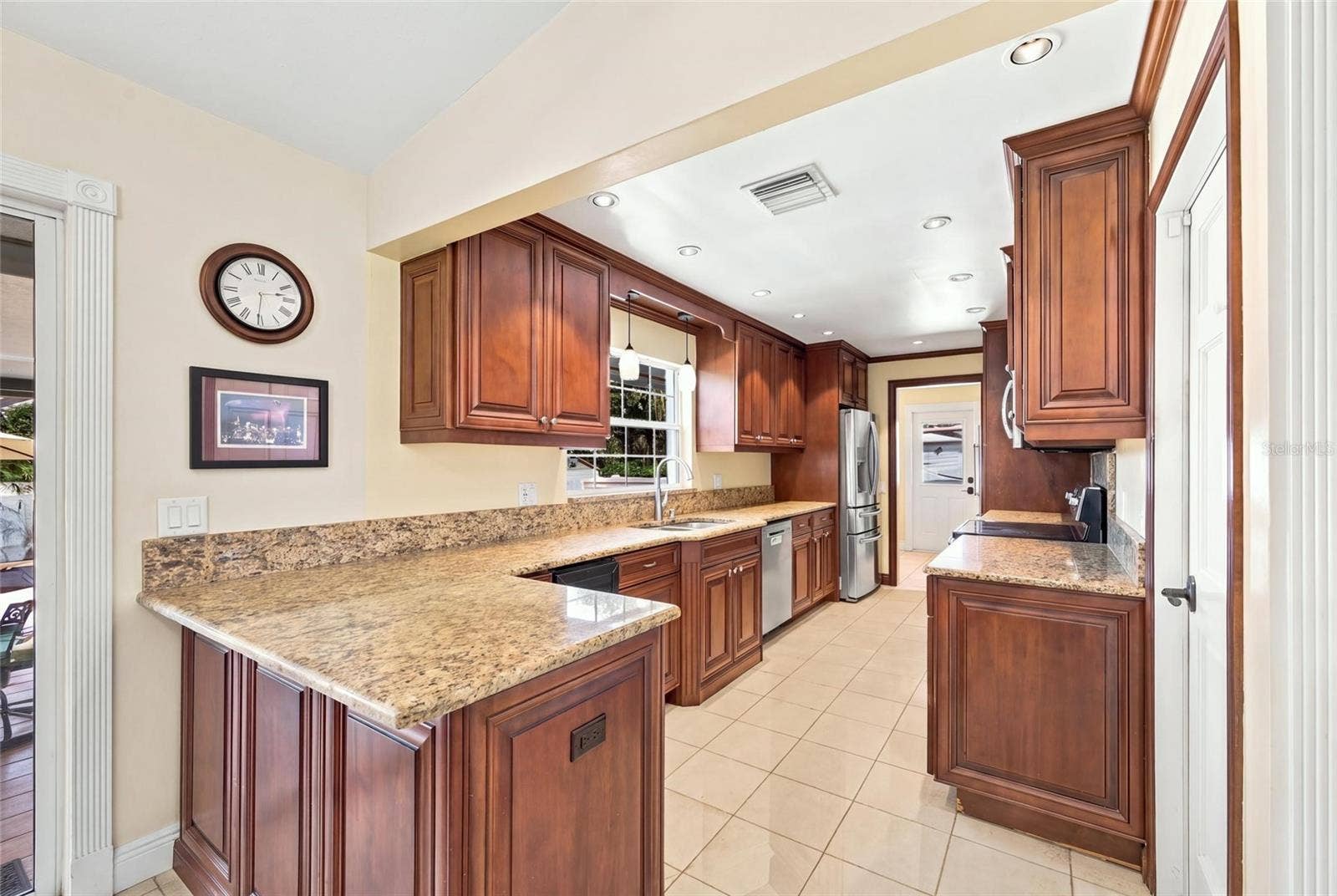 13205 MARIA AVENUE, Clermont, FL 34711 Kitchen with granite counters & wine cooler