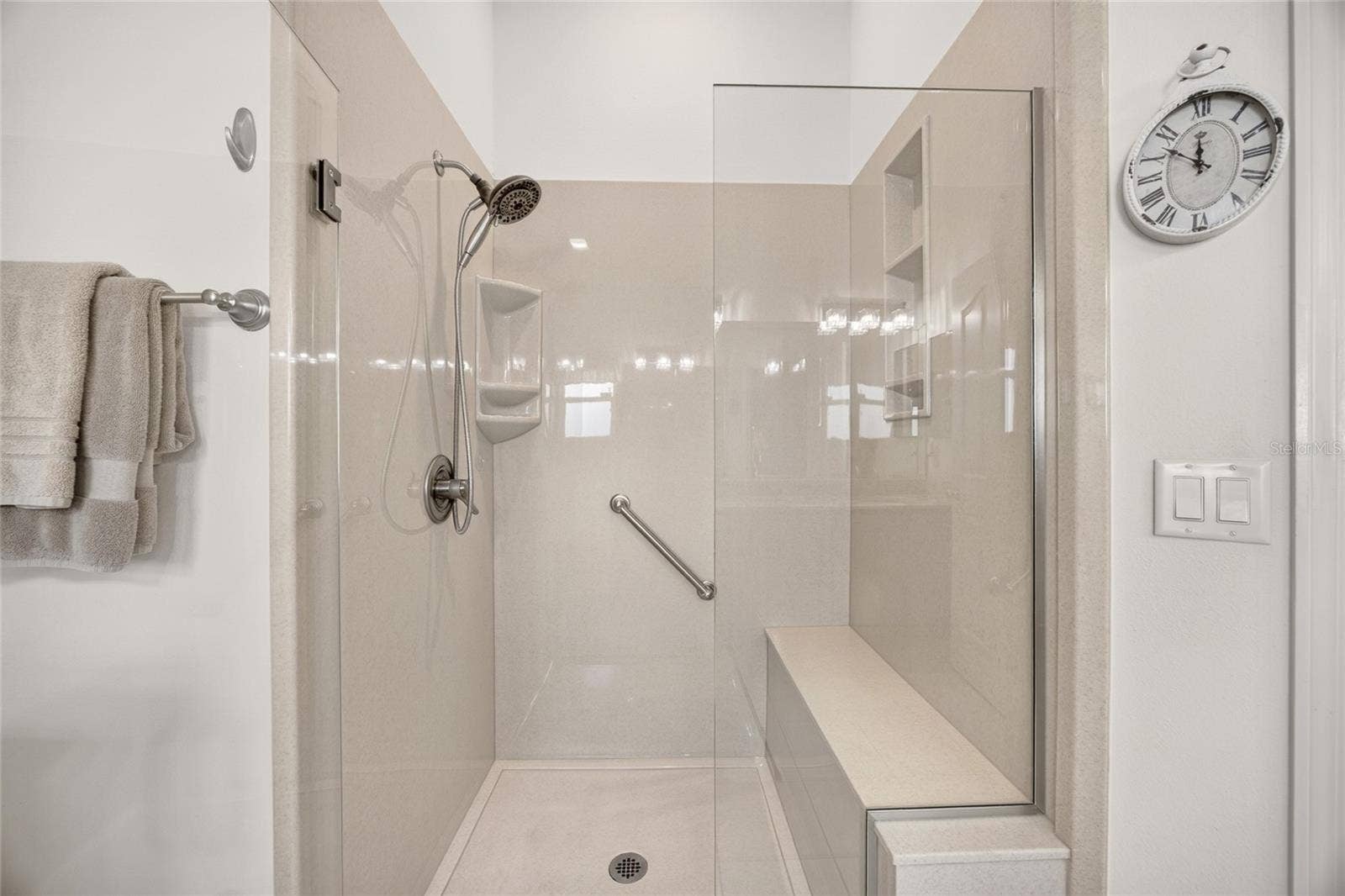 17942 SE 88TH CASCADE COURT, The Villages, FL 32162 A glass-enclosed shower and neutral finishes complete this inviting space.