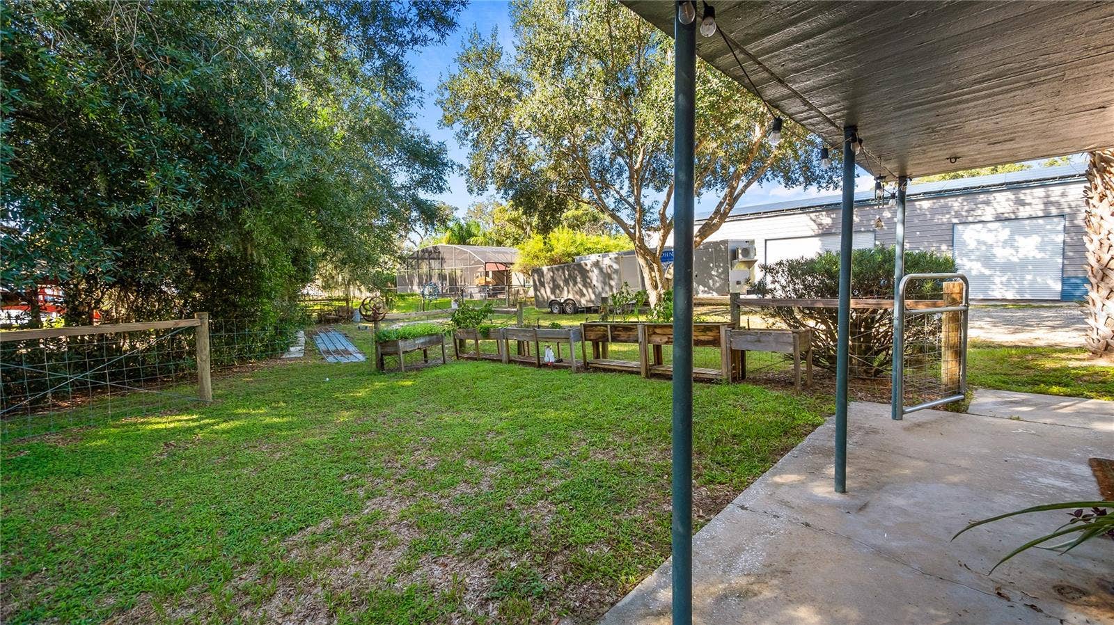 1730 NITA PLACE, Clermont, FL 34711 Detached garage and apartment. 2 car parking plus storage. Driveway off Lakeshore drive, little fenced in back yard. Full kitchen, laundry closet. remodeled. Pre wired for generator plug access so it can be run on a generator.