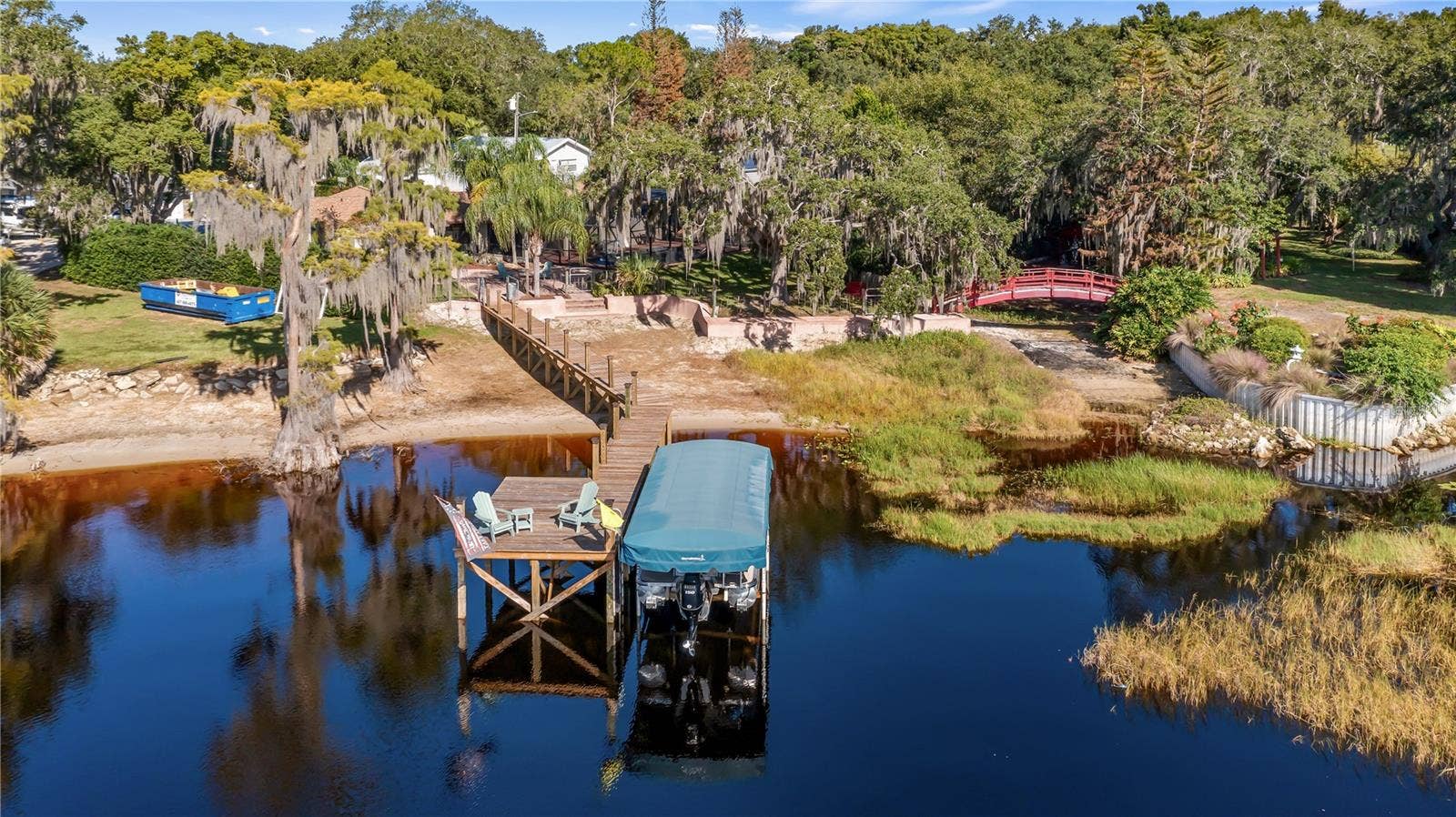 1730 NITA PLACE, Clermont, FL 34711 Aerial from lake Minnehaha of 1730 Nita Place Clermont, FLResurfaced Seawall in 2026, Renovated Dock platform 10/2022, Renovated Dock walkway 5/2026