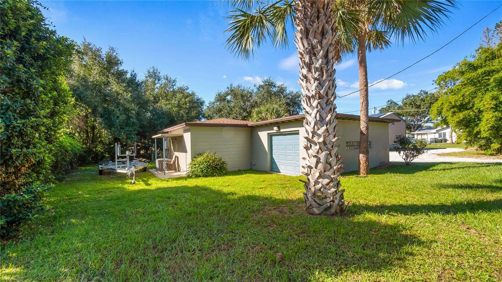 1730 NITA PLACE, Clermont, FL 34711 Detached garage and apartment. 2 car parking plus storage. Driveway off Lakeshore drive, little fenced in back yard. Full kitchen, laundry closet. remodeled. Pre wired for generator plug access so it can be run on a generator.