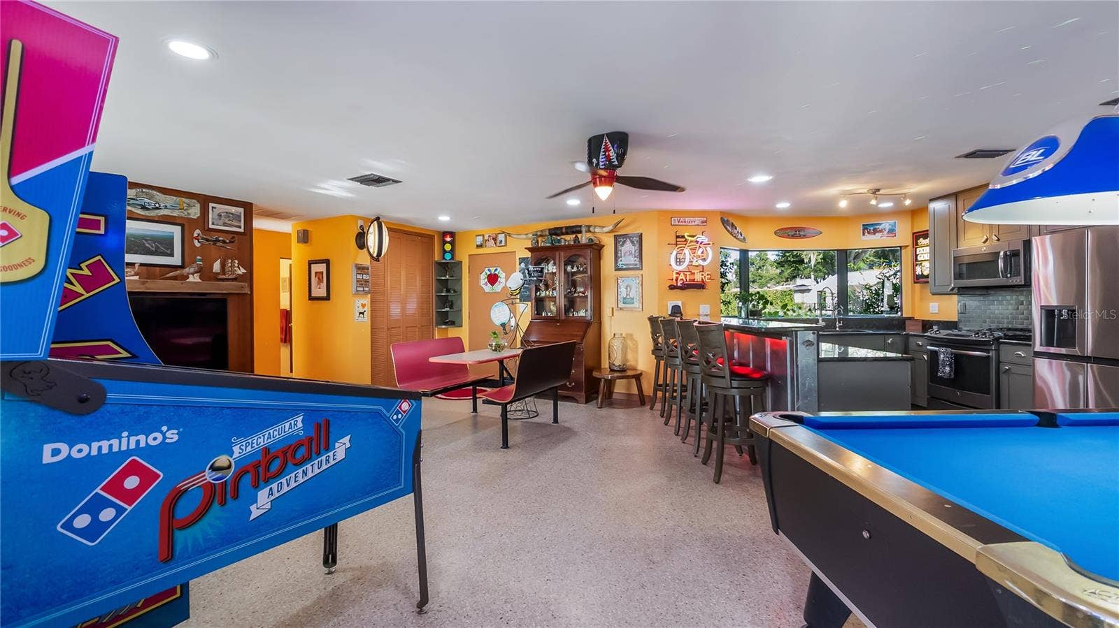 1730 NITA PLACE, Clermont, FL 34711 Main Home - Great room/kitchen/living room combo: Living room used as gathering space for game room fun. Two Sliders go out to covered back porch and screened in pool