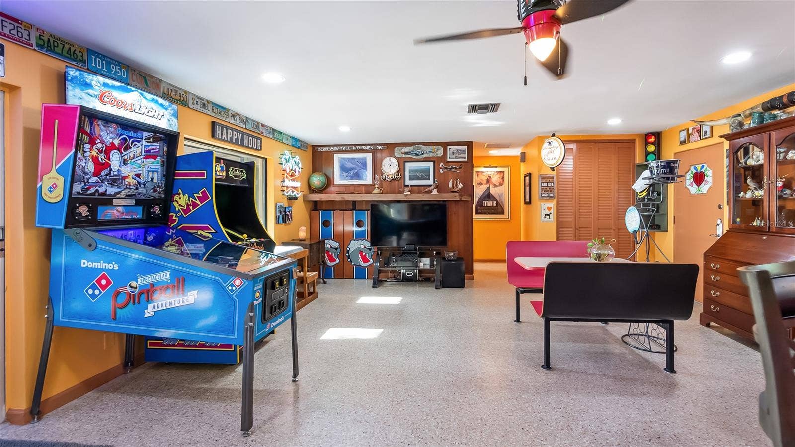 1730 NITA PLACE, Clermont, FL 34711 Main Home - Great room/kitchen/living room combo: Living room used as gathering space for game room fun. Two Sliders go out to covered back porch and screened in pool