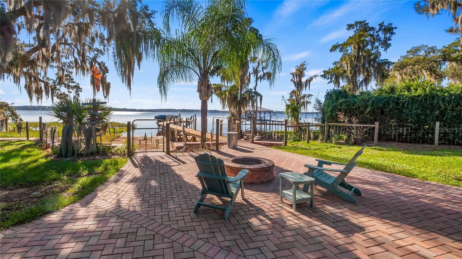 1730 NITA PLACE, Clermont, FL 34711 Fire pit between main home/pool area and Lake Minnehaha