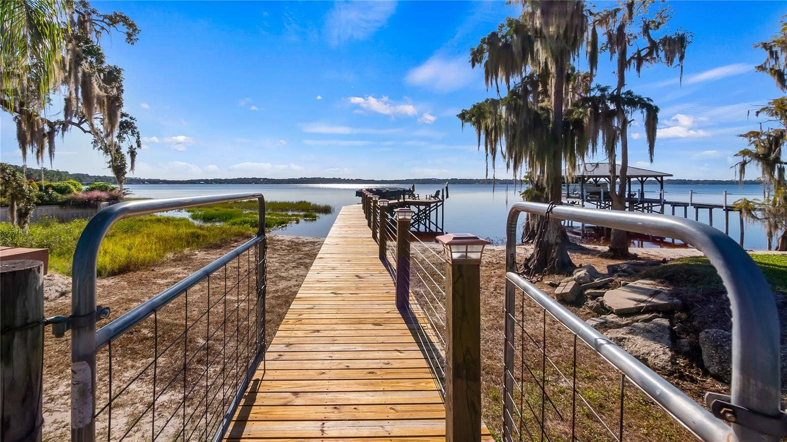 1730 NITA PLACE, Clermont, FL 34711 Resurfaced Seawall in 2026, Renovated Dock platform 10/2022, Renovated Dock walkway 5/2026