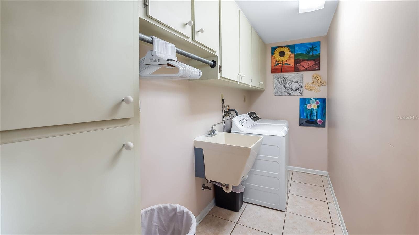1730 NITA PLACE, Clermont, FL 34711 Laundry room located on north side of main home. Next to exit door to backyard/pool