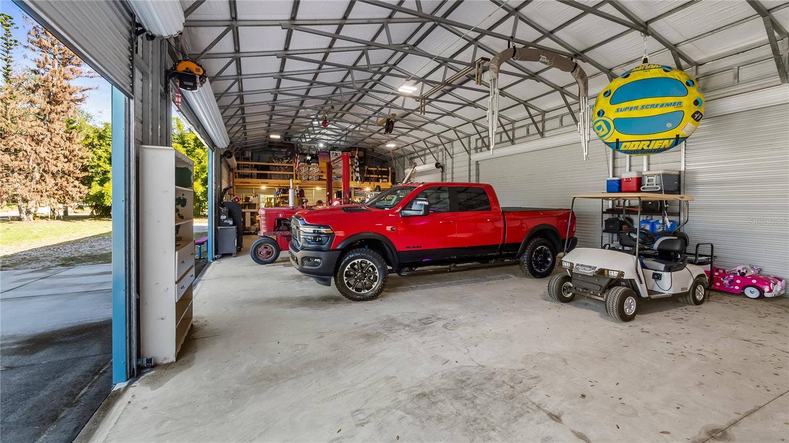 1730 NITA PLACE, Clermont, FL 34711 HUGE 30X75 Metal Building installed in October of 2022, has 6 large bay doors, some have electric openers