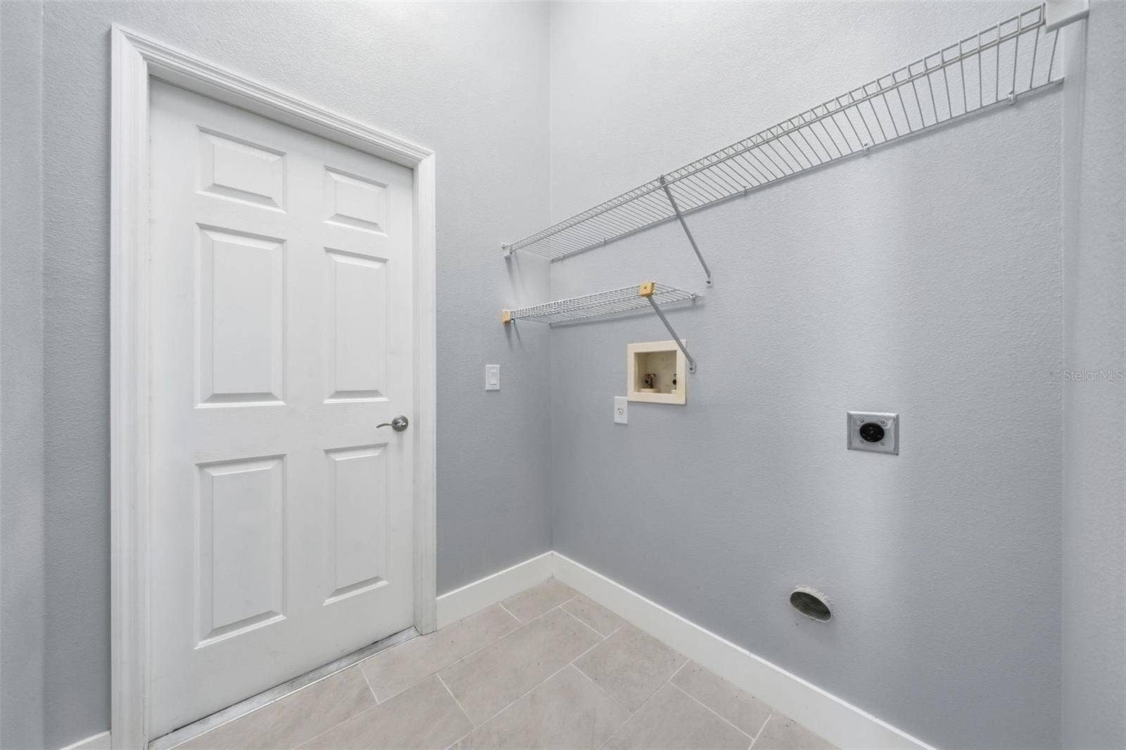 Laundry room leading to the garage