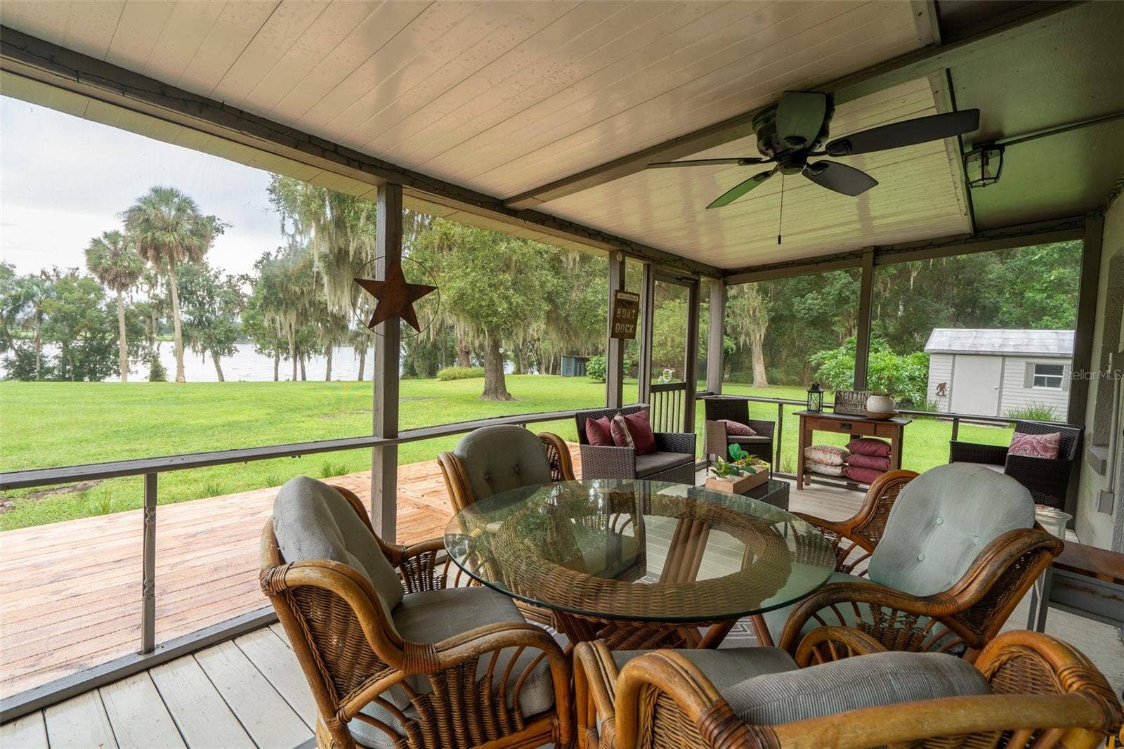 35935 NOLEN LANE, Eustis, FL 32736 Screened porch looking out at lake