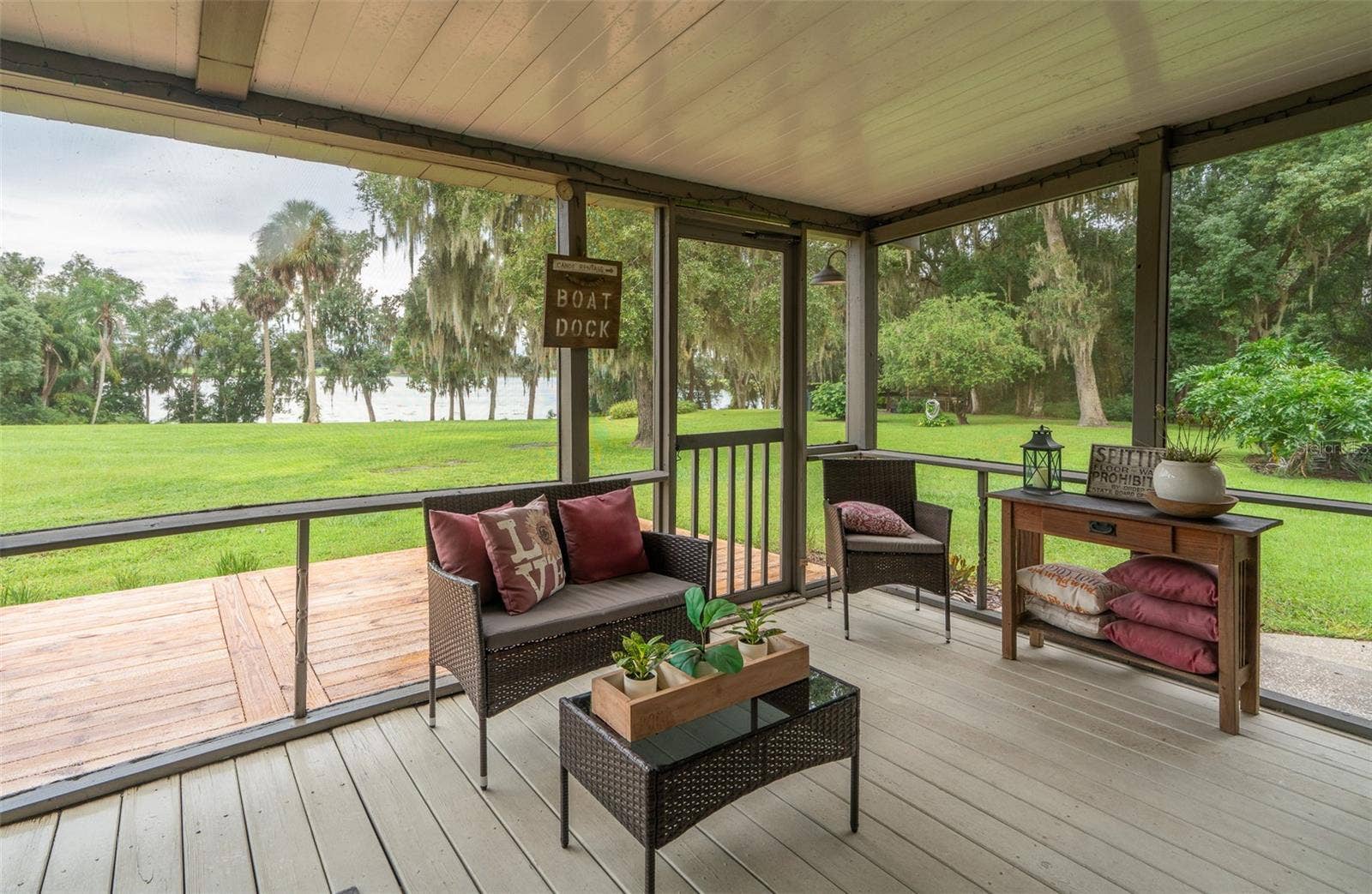 35935 NOLEN LANE, Eustis, FL 32736 Screened porch looking out at lake