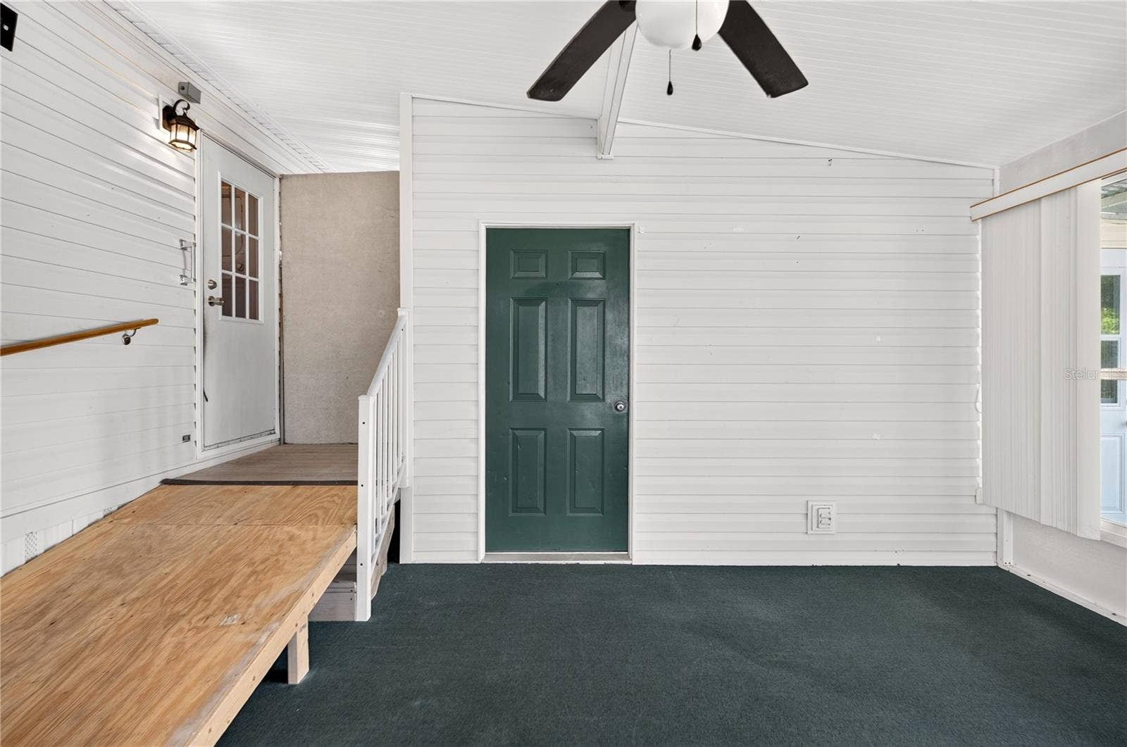 2722 VINDALE ROAD, Tavares, FL 32778 Side door entry to Florida room and workshop/bonus room