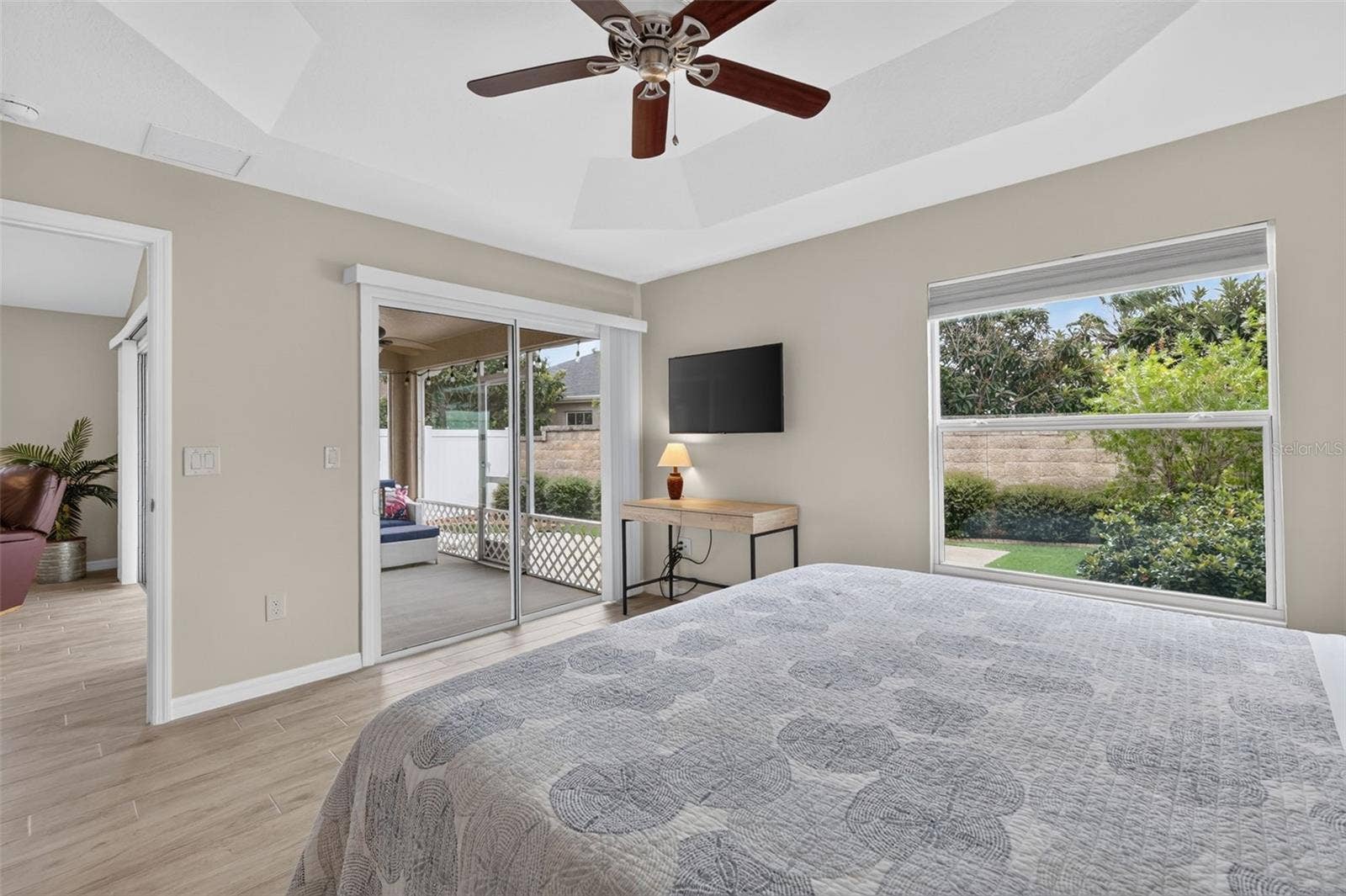 3435 ALLISON PLACE, The Villages, FL 32163 Primary Bedroom with view to the Private Courtyard