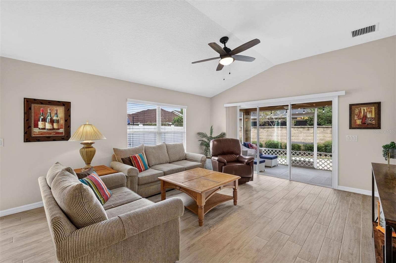 3435 ALLISON PLACE, The Villages, FL 32163 Living Room with Sliding Doors to the Lanai