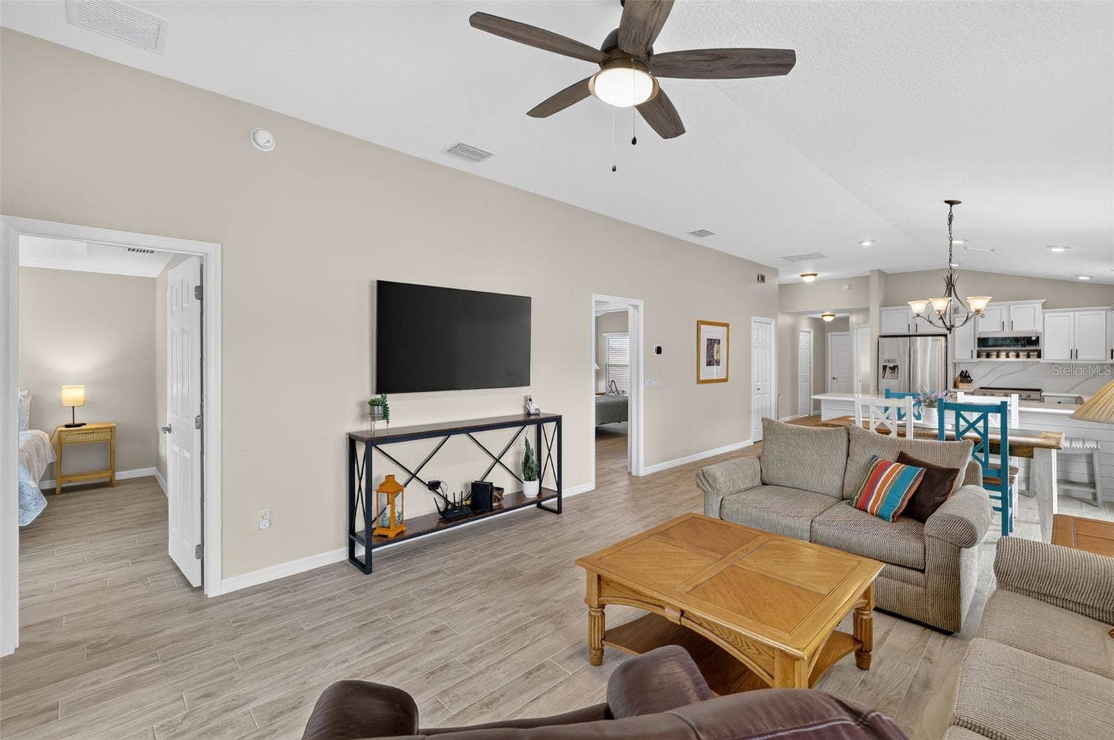 3435 ALLISON PLACE, The Villages, FL 32163 Living Room - Door to the left goes to the Primary Suite and door to the right goes to the 2nd Bedroom and Bath