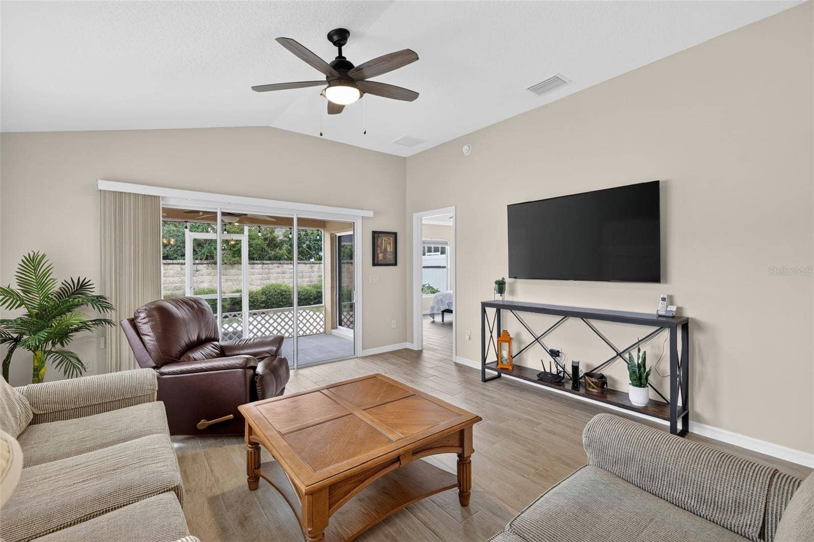 3435 ALLISON PLACE, The Villages, FL 32163 Living Rom - Door goes to the Primary Suite