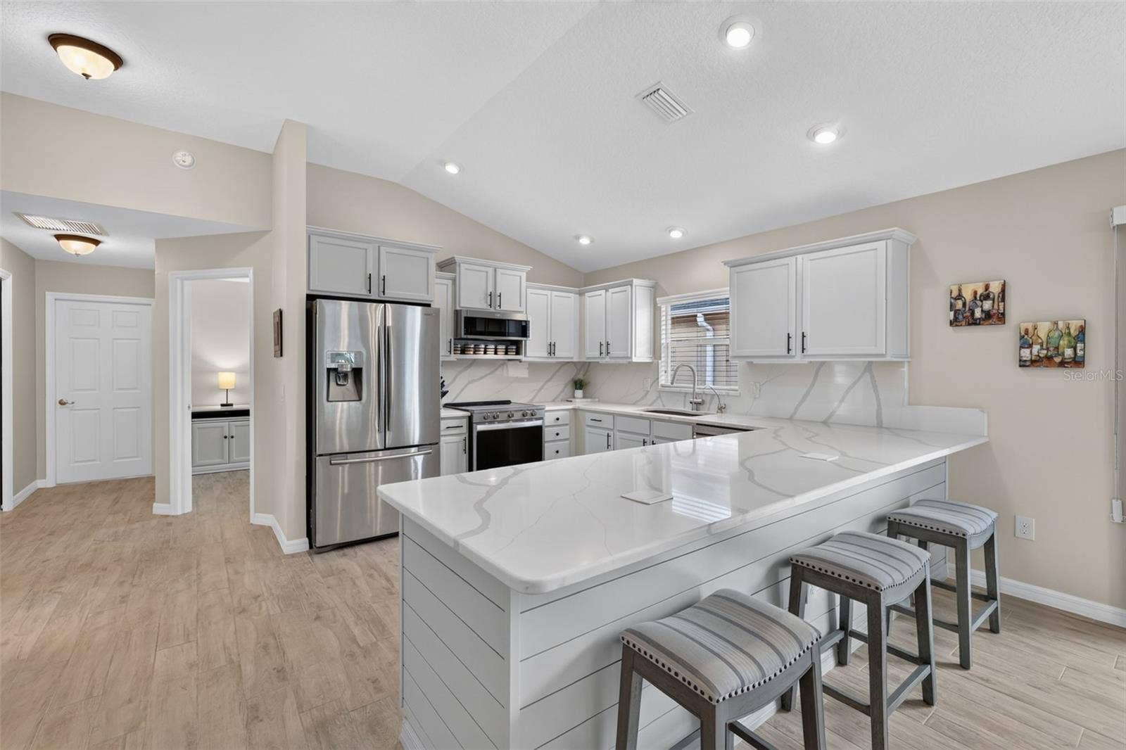 3435 ALLISON PLACE, The Villages, FL 32163 Kithen - 3rd Bedroom is behind the Kitchen - Door in the background is to the Garage