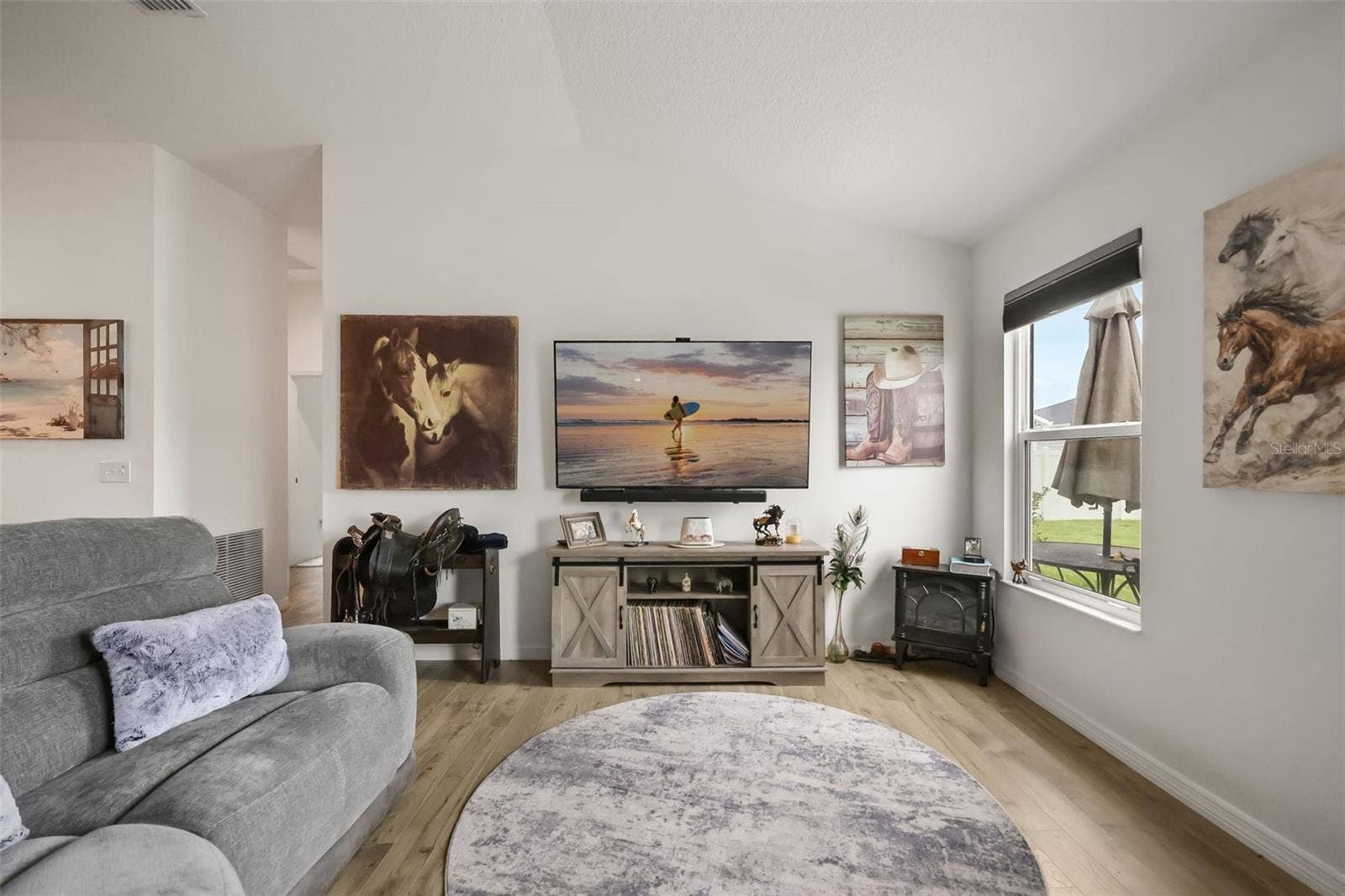 1533 LUCA LANE, The Villages, FL 34762 TV stand and wall art does not convey