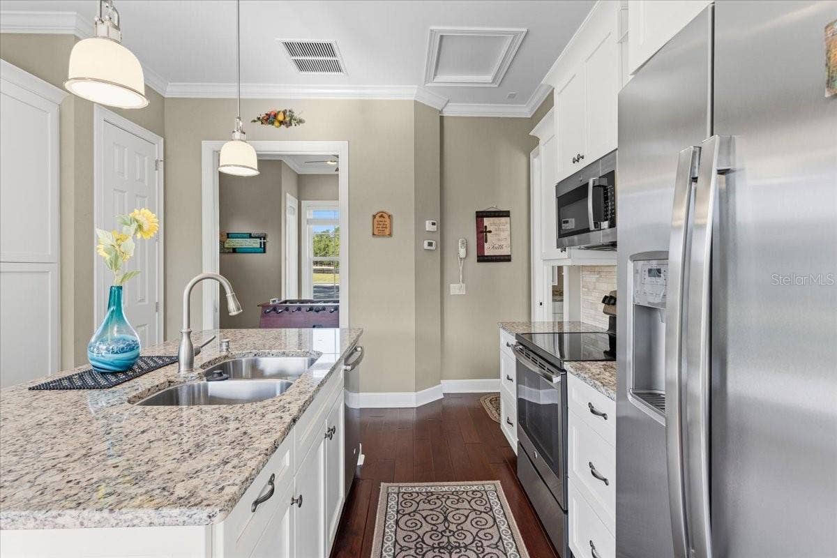 10401 NW 153RD TERRACE, Alachua, FL 32615 Guest House Kitchen and view of Bedroom #1