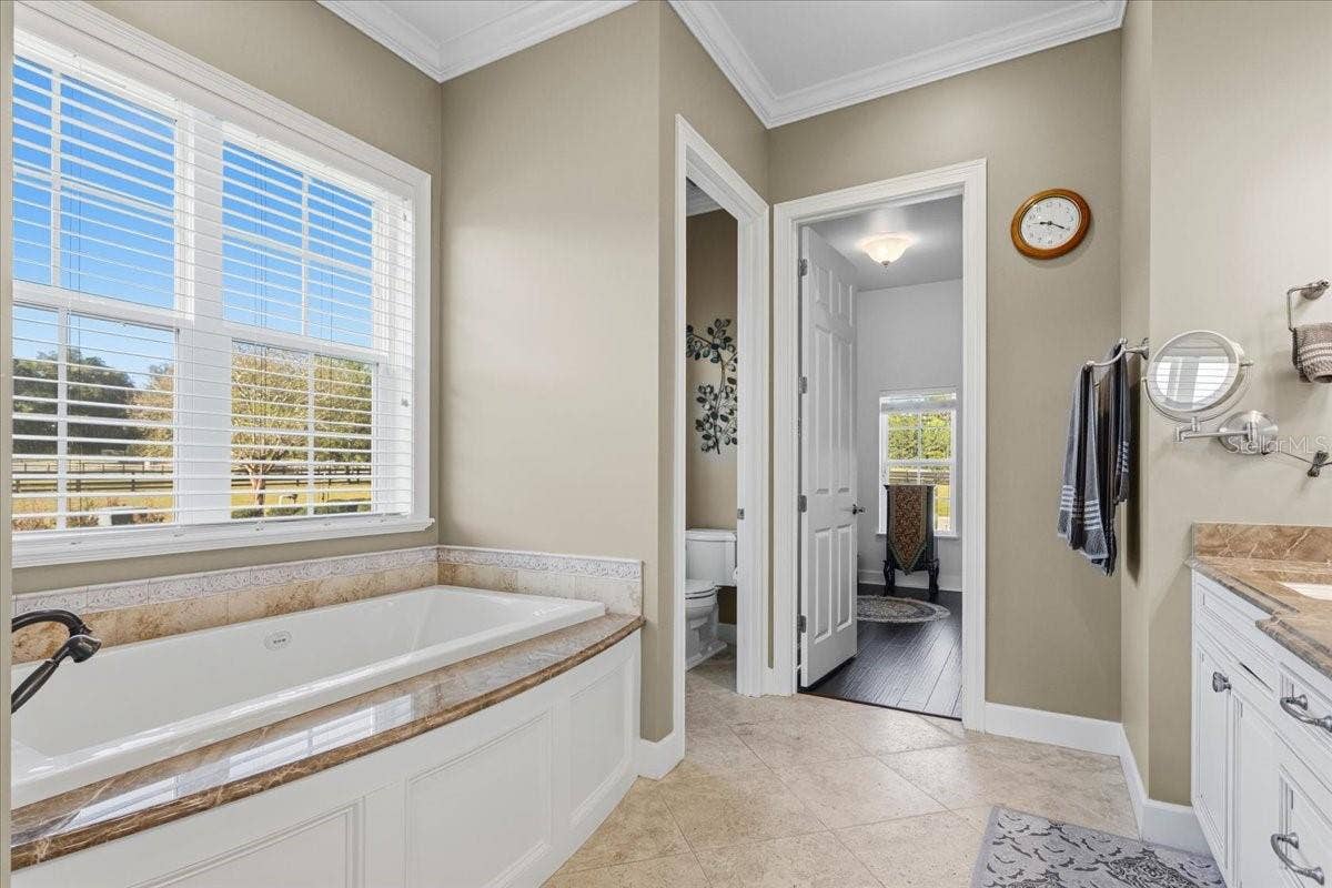 10401 NW 153RD TERRACE, Alachua, FL 32615 Primary bathroom en suite (downstairs)