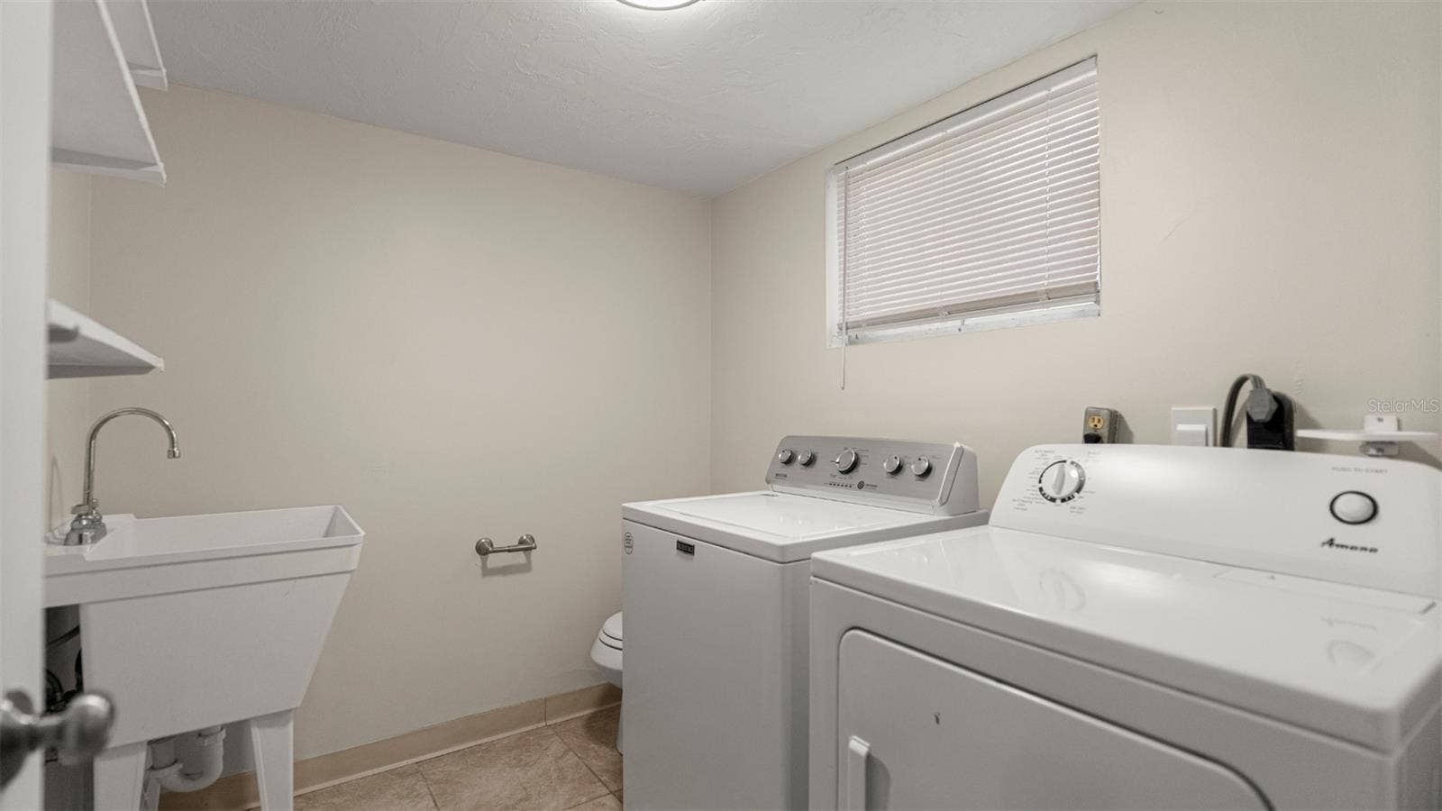 Laundry and half bath off of bottom floor bonus room