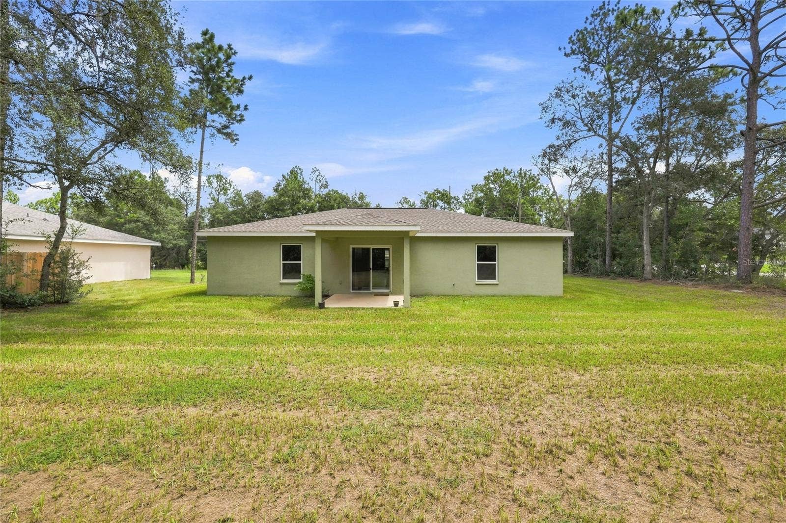7390 N IRELAND DRIVE, Dunnellon, FL 34434 Back of Home