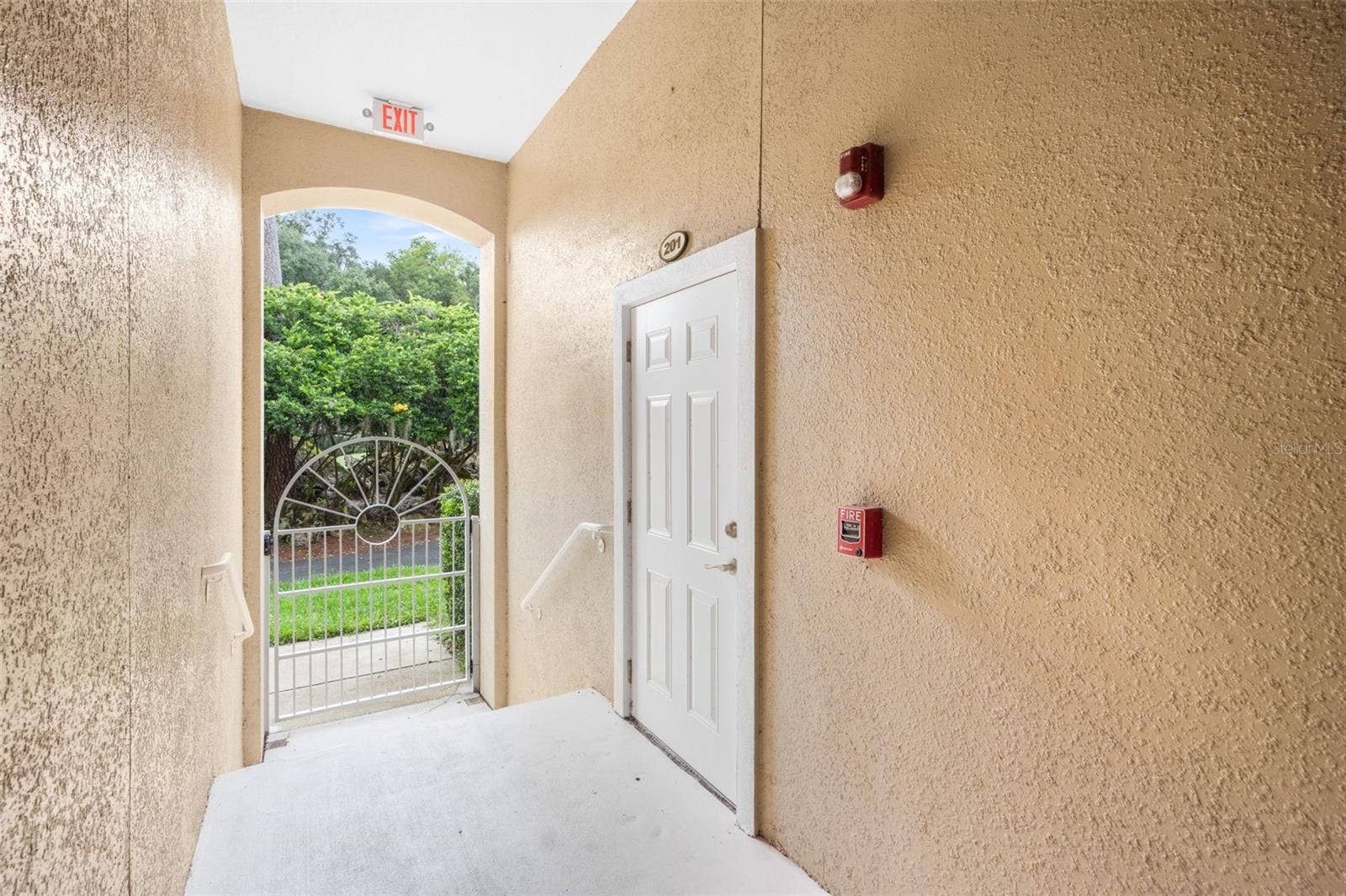 4715 SW 91ST DRIVE, #201, Gainesville, FL 32608 Back door to garage, under cover