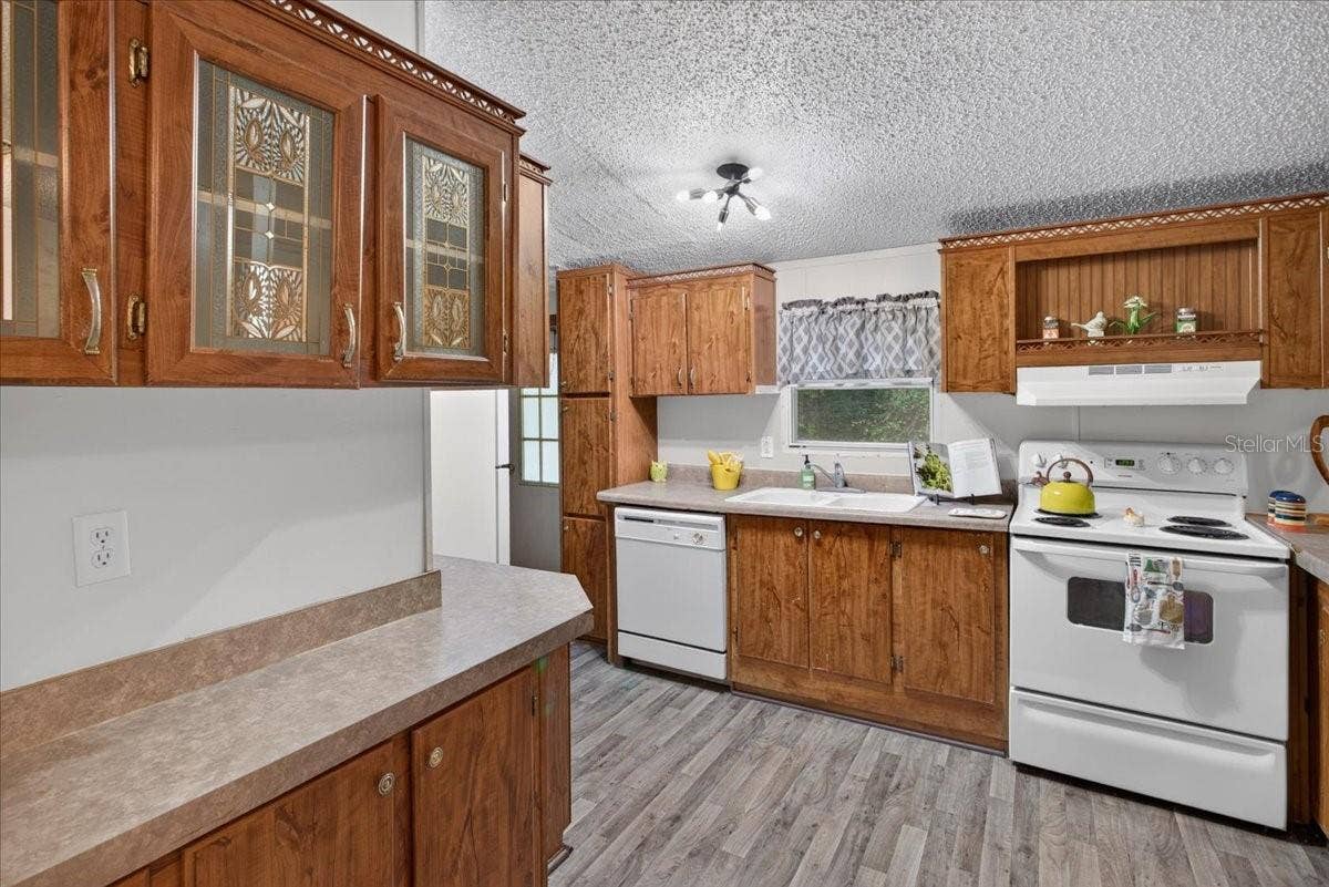 7030 NW 167TH PLACE, Trenton, FL 32693 Spacious kitchen - so much storage space!