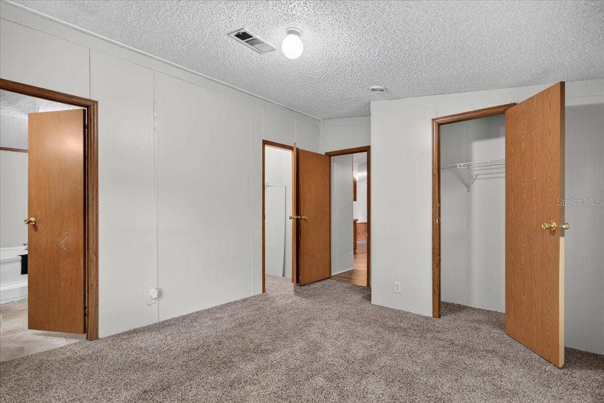 7030 NW 167TH PLACE, Trenton, FL 32693 Primary Bedroom with two separate walk-in closets!