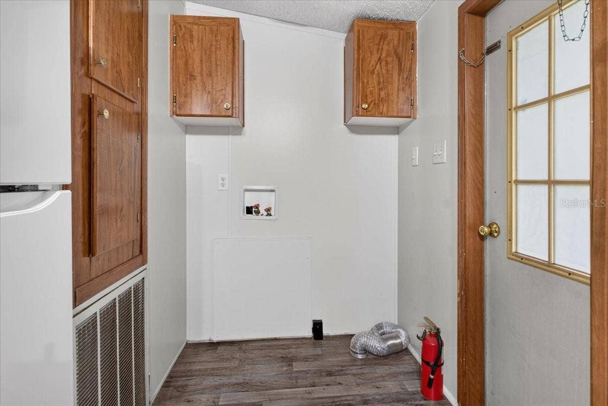 7030 NW 167TH PLACE, Trenton, FL 32693 Utility area with overhead cabinets for even more storage space