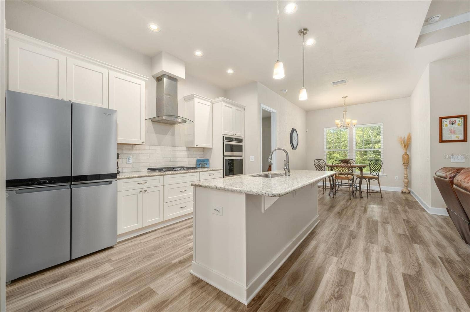 1402 NW 132ND BOULEVARD, Newberry, FL 32669 Open Concept Kitchen, Living Room, and Breakfast Nook